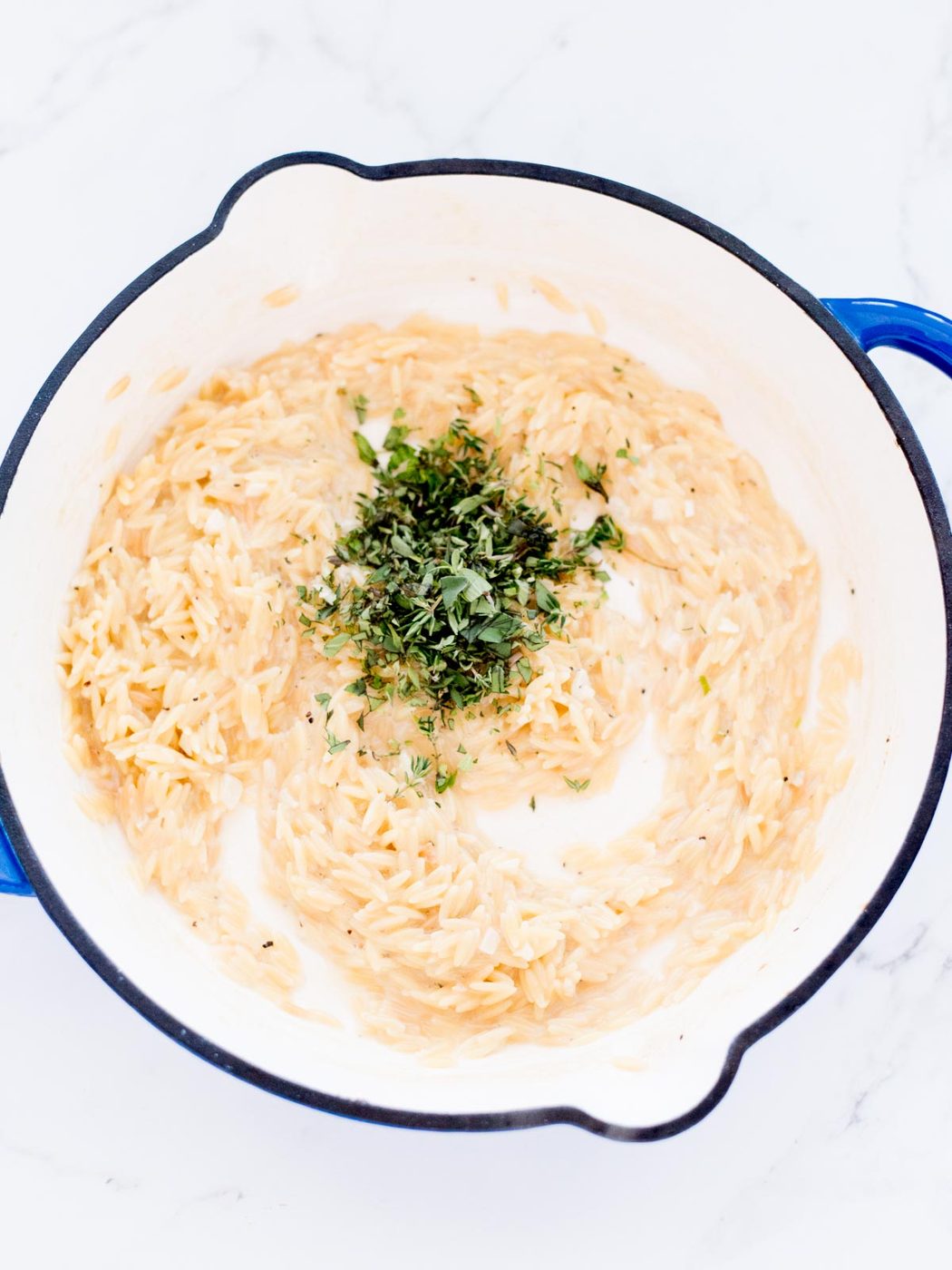 herbs added to cooked orzo