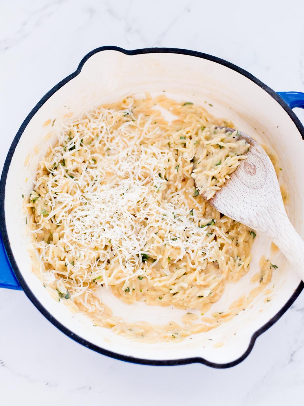grated parmesan added to the skillet