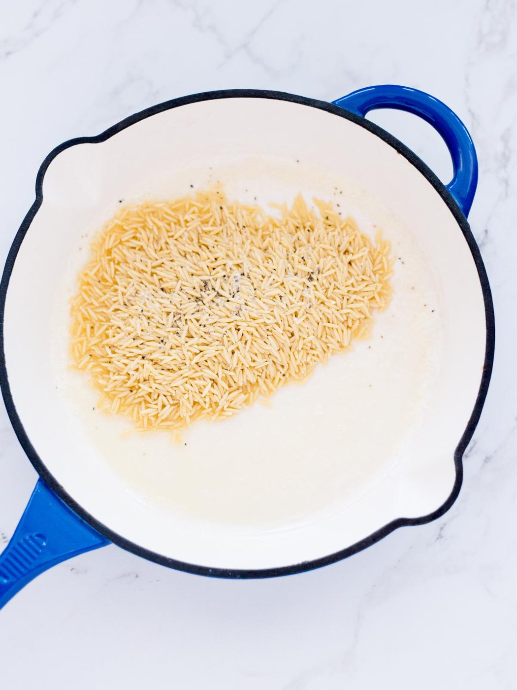 salt and pepper added to the orzo and butter