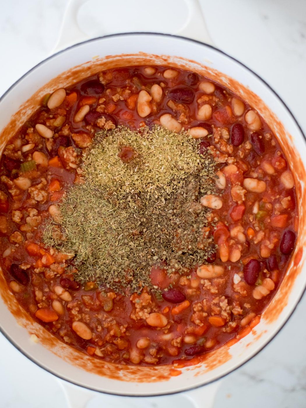 spices added to soup pot
