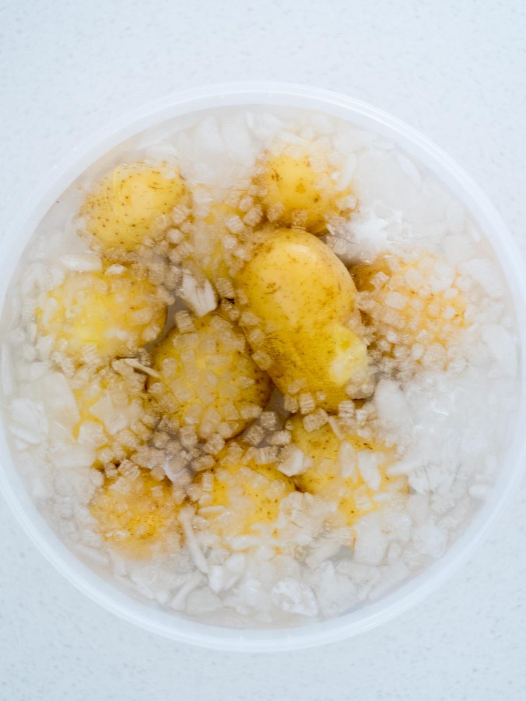 cooked potatoes and eggs in an ice bath