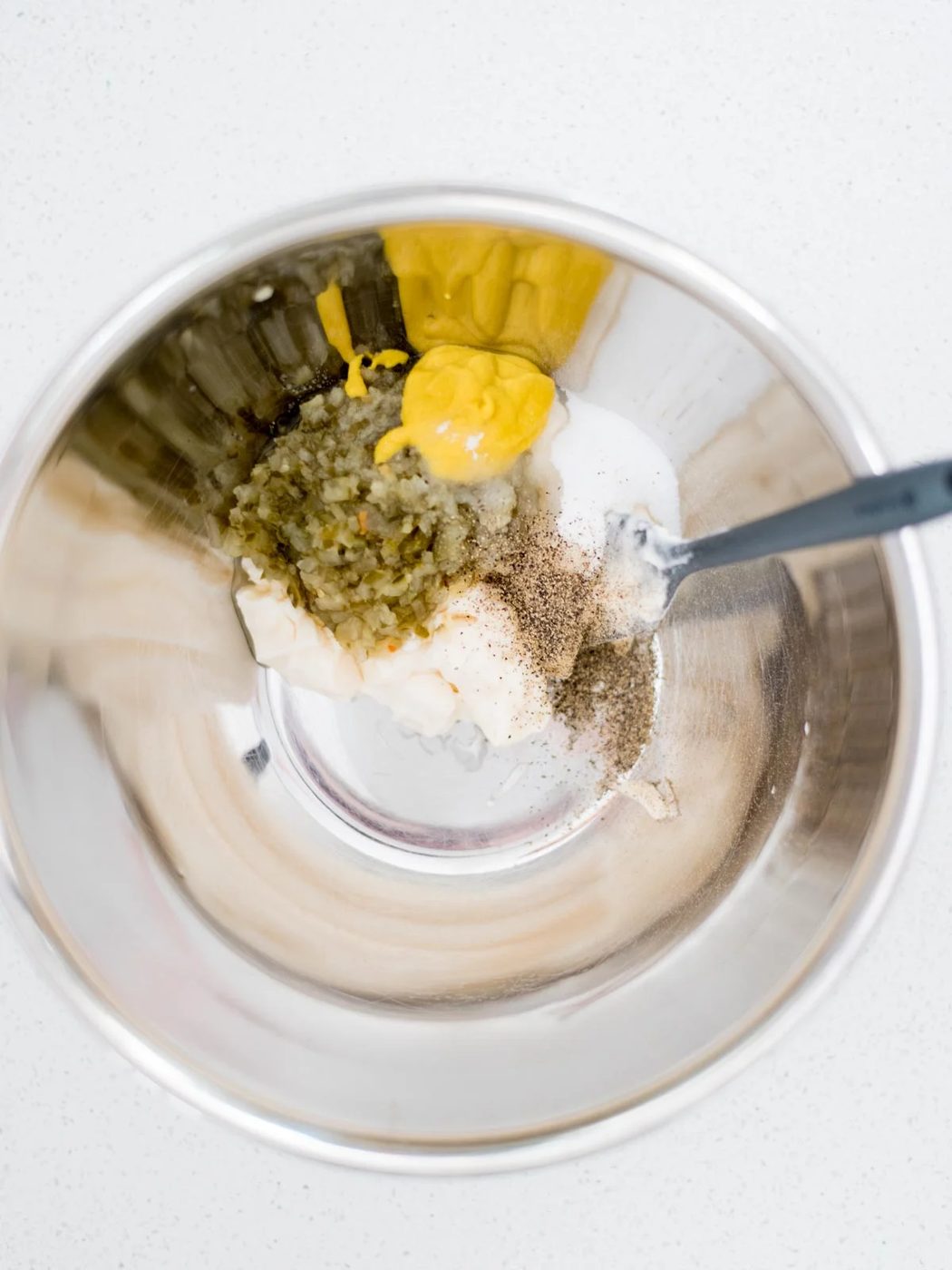 potato salad dressing ingredients in a mixing bowl