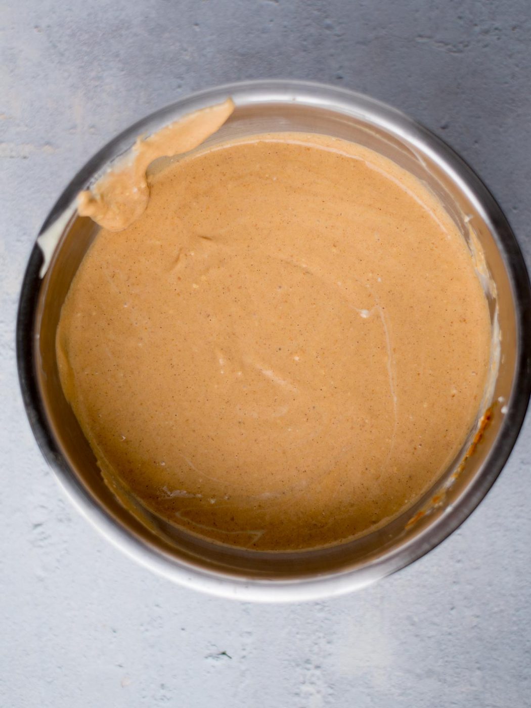pumpkin cheesecake filling mixed together in a bowl