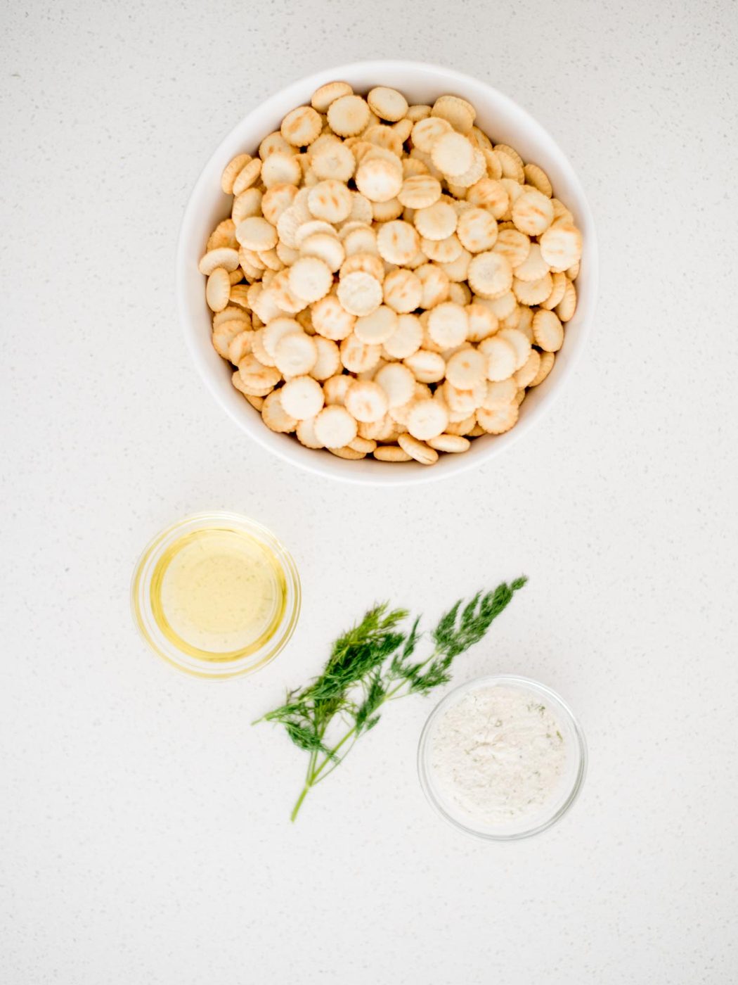 Ingredients shown needed to prepare seasoned oyster crackers.