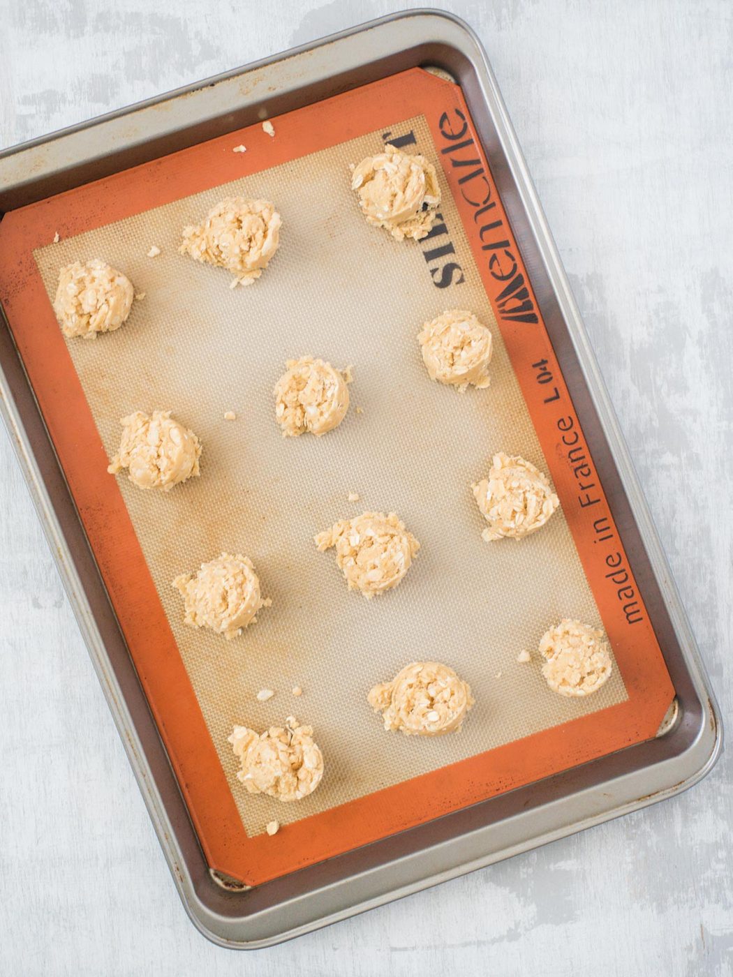 scooped cookies on a baking sheet