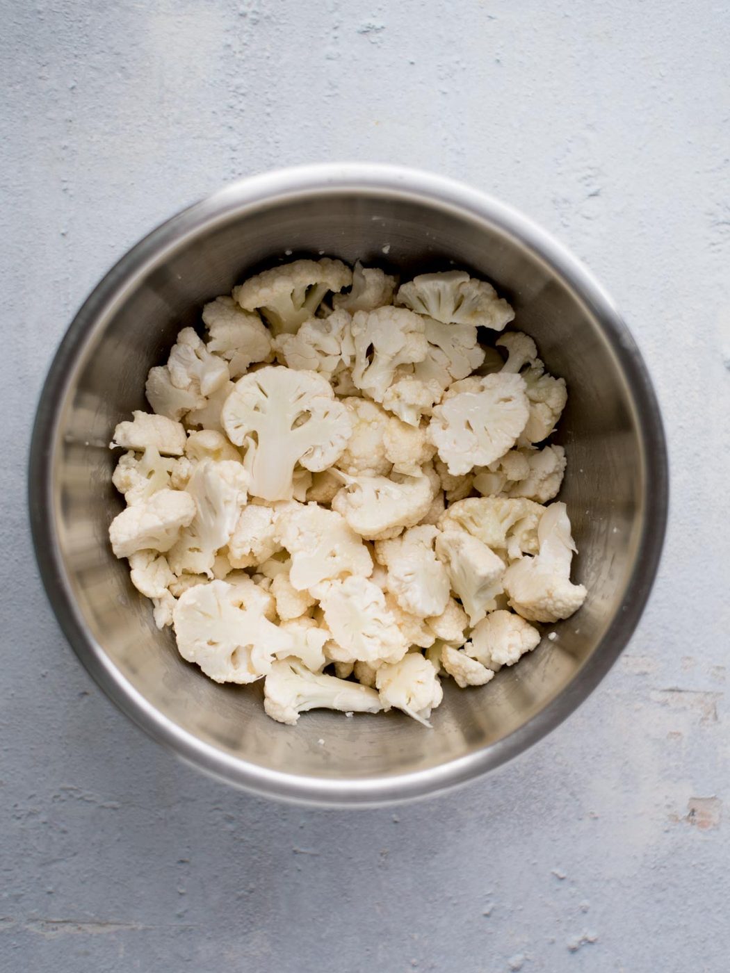 chopped cauliflower in a mixing bowl