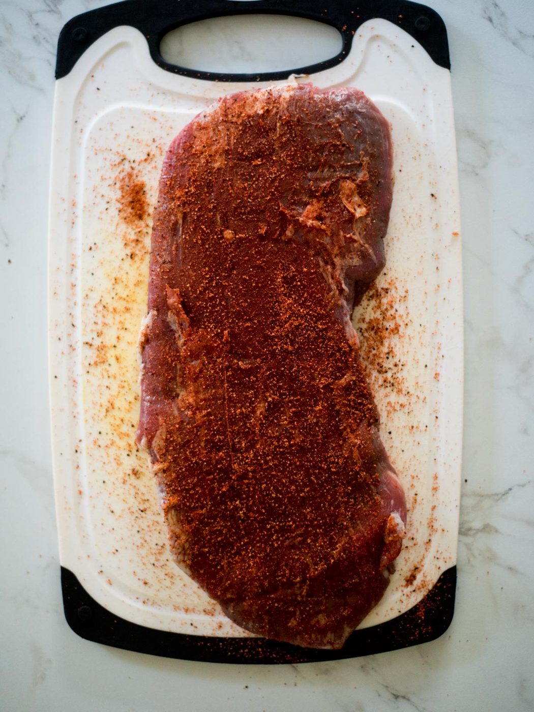 flank steak coated with fajita seasoning