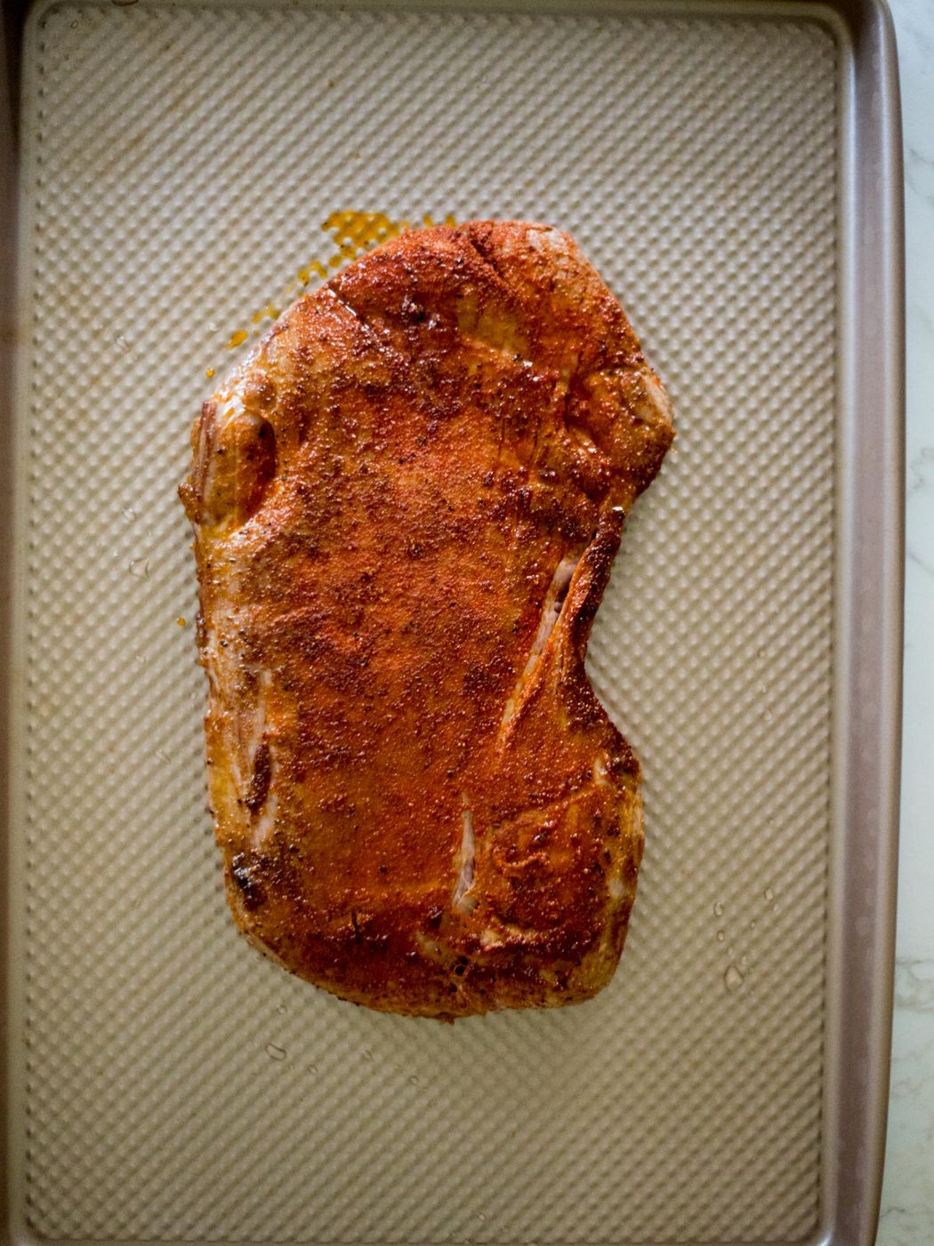 seared flank steak on a sheet pan