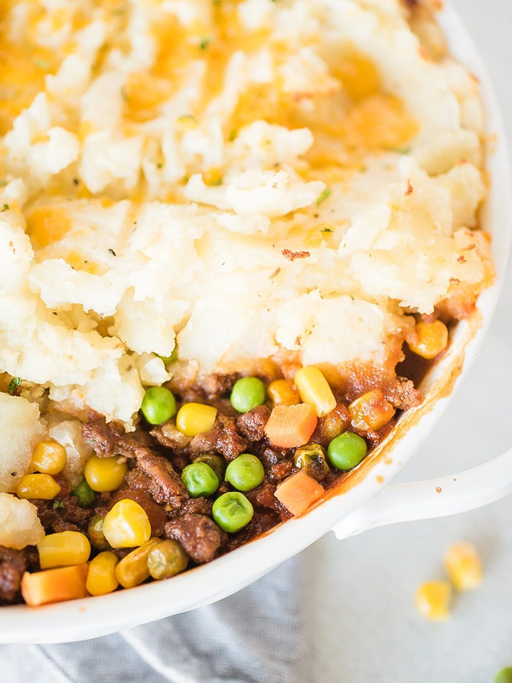up close of inside of shepherds pie in a white baking dish
