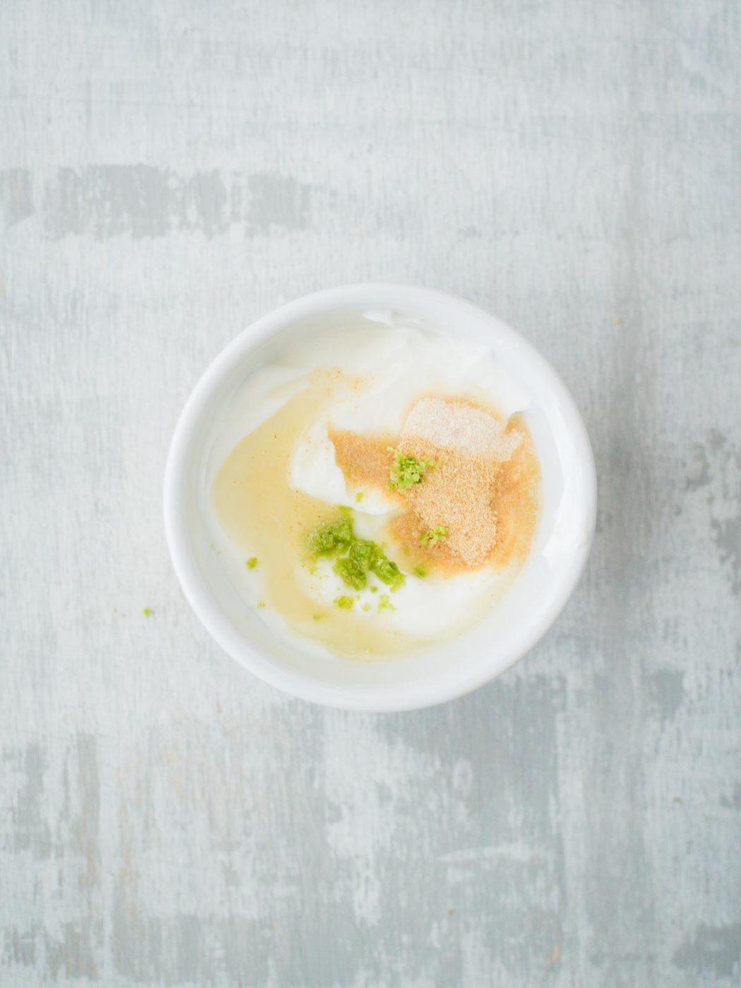 creamy lime sauce ingredients in bowl with lime juice