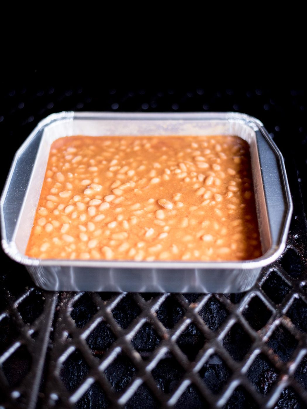 baked beans inside of a pellet smoker