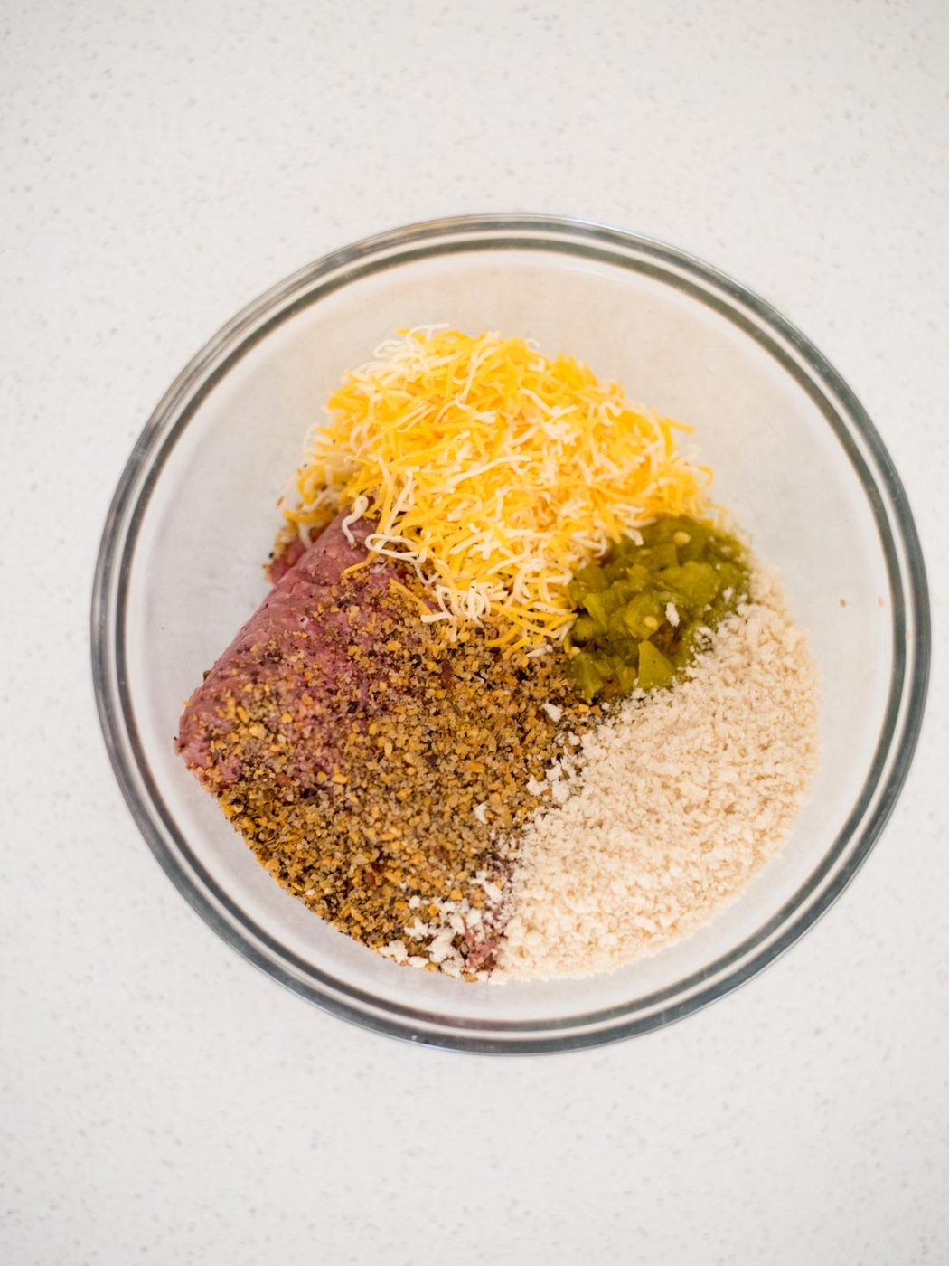 ingredients for pit boss smoked hamburgers in a mixing bowl
