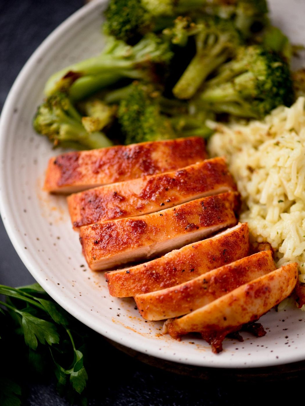 Slices of smoked chicken breast on a plate.