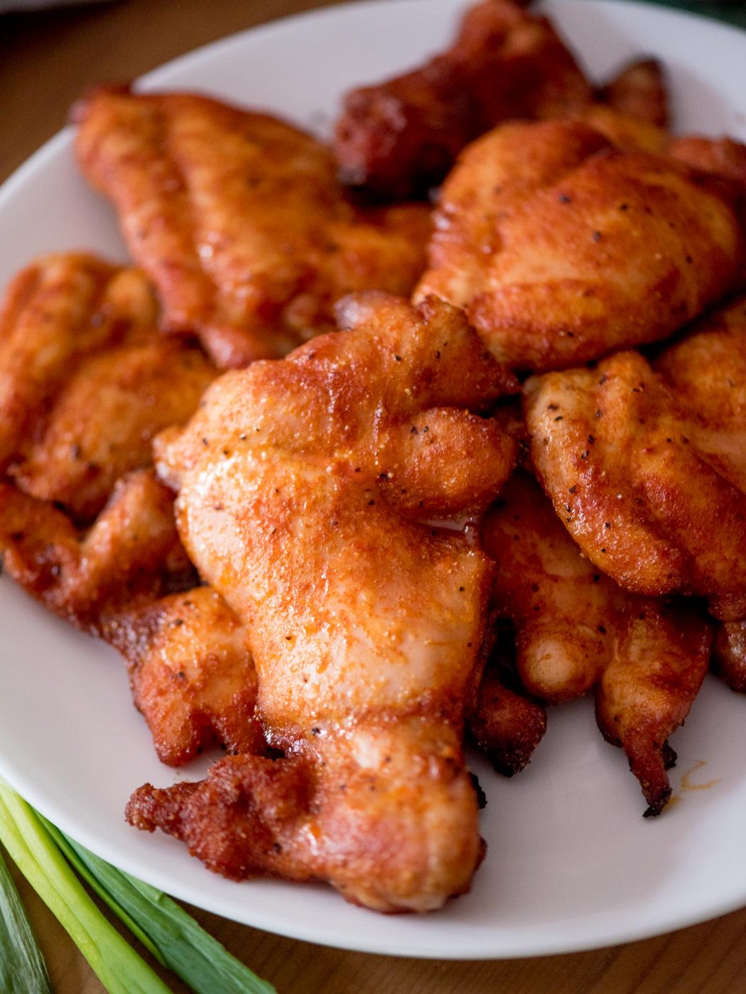 Plate of smoked chicken thighs.