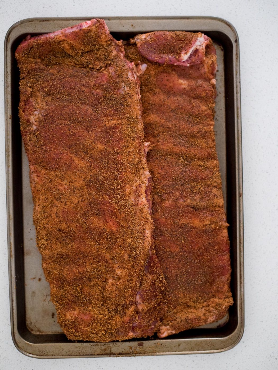 st louis style ribs covered in dry rub
