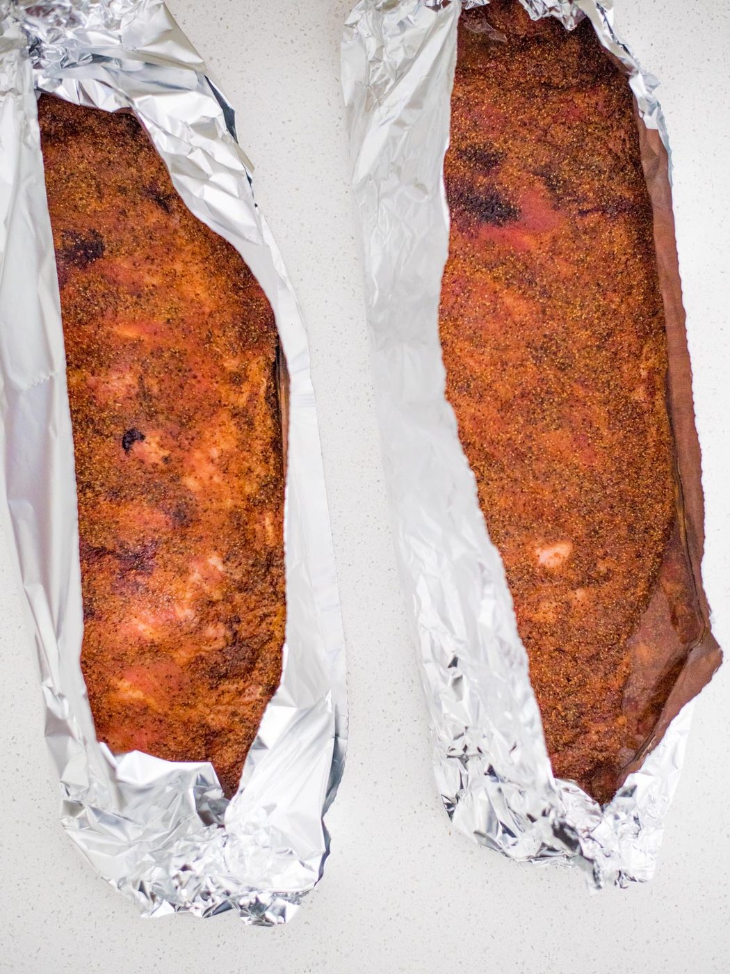 smoked ribs in foil with apple juice