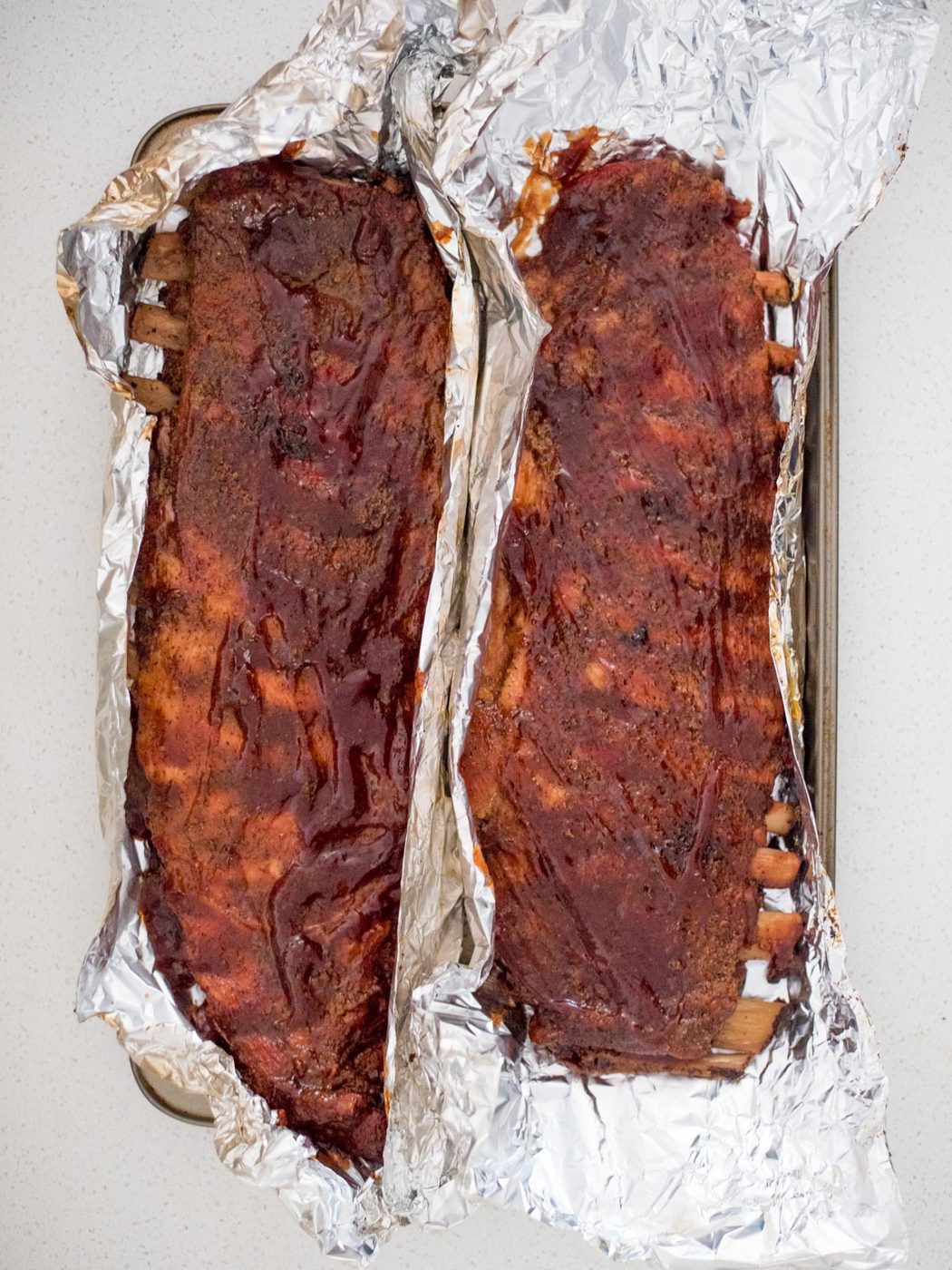 pit boss smoked ribs basted with bbq sauce on foil