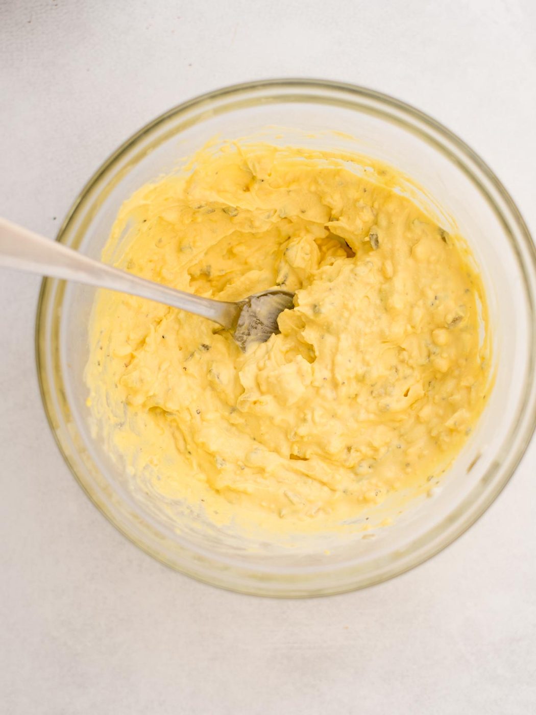 Creamy egg yolk filling combined in a mixing bowl.