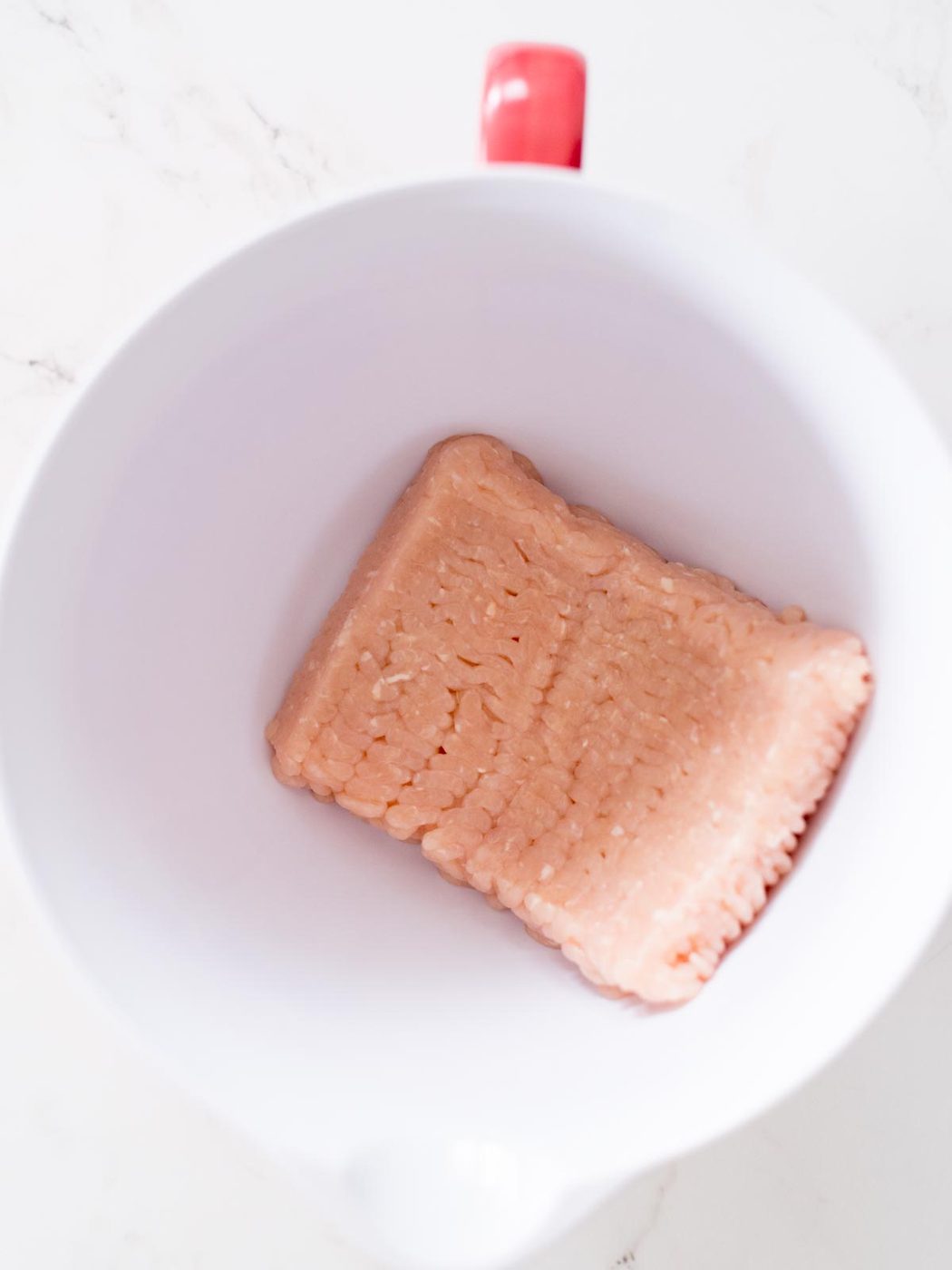 ground chicken in a mixing bowl