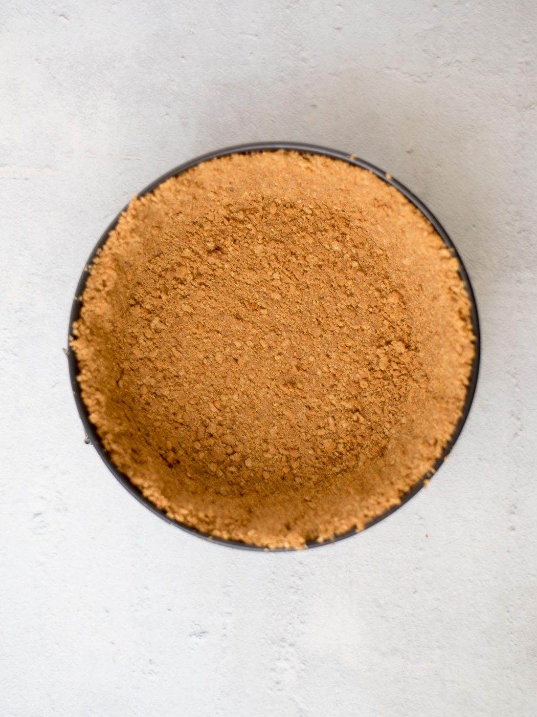 graham cracker crust in a springform pan