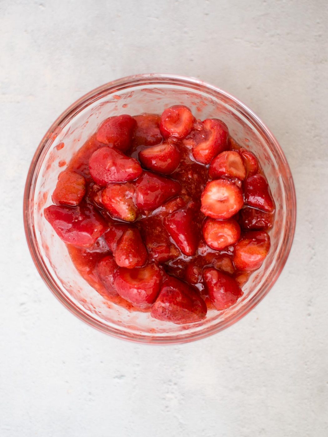 strawberry pie filling in a glass mixing bowl