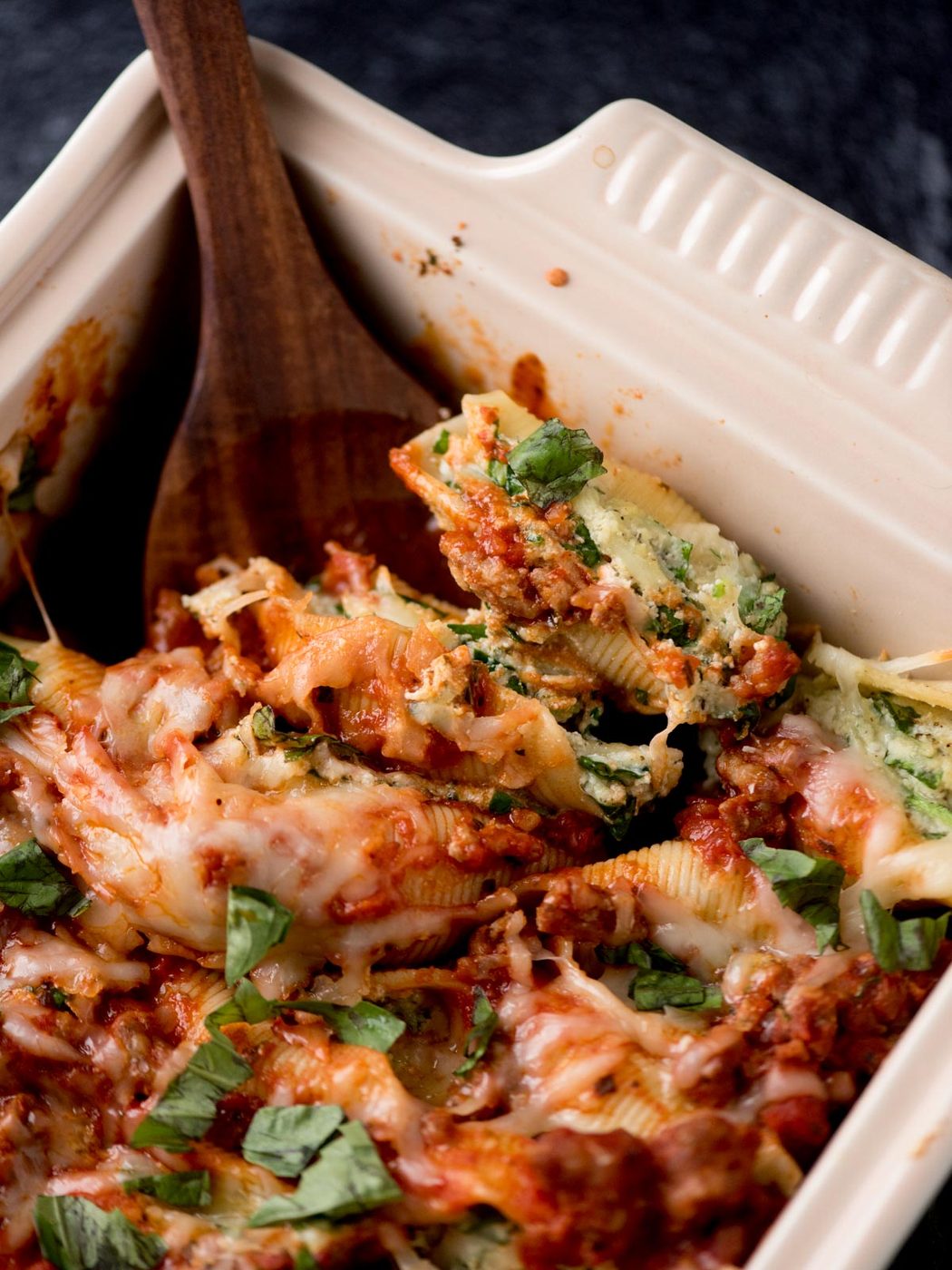 stuffed shells with meat sauce in a baking dish