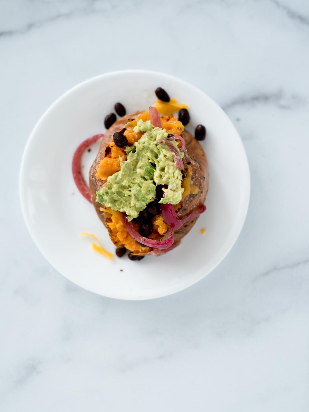 mashed avocado on sweet potato