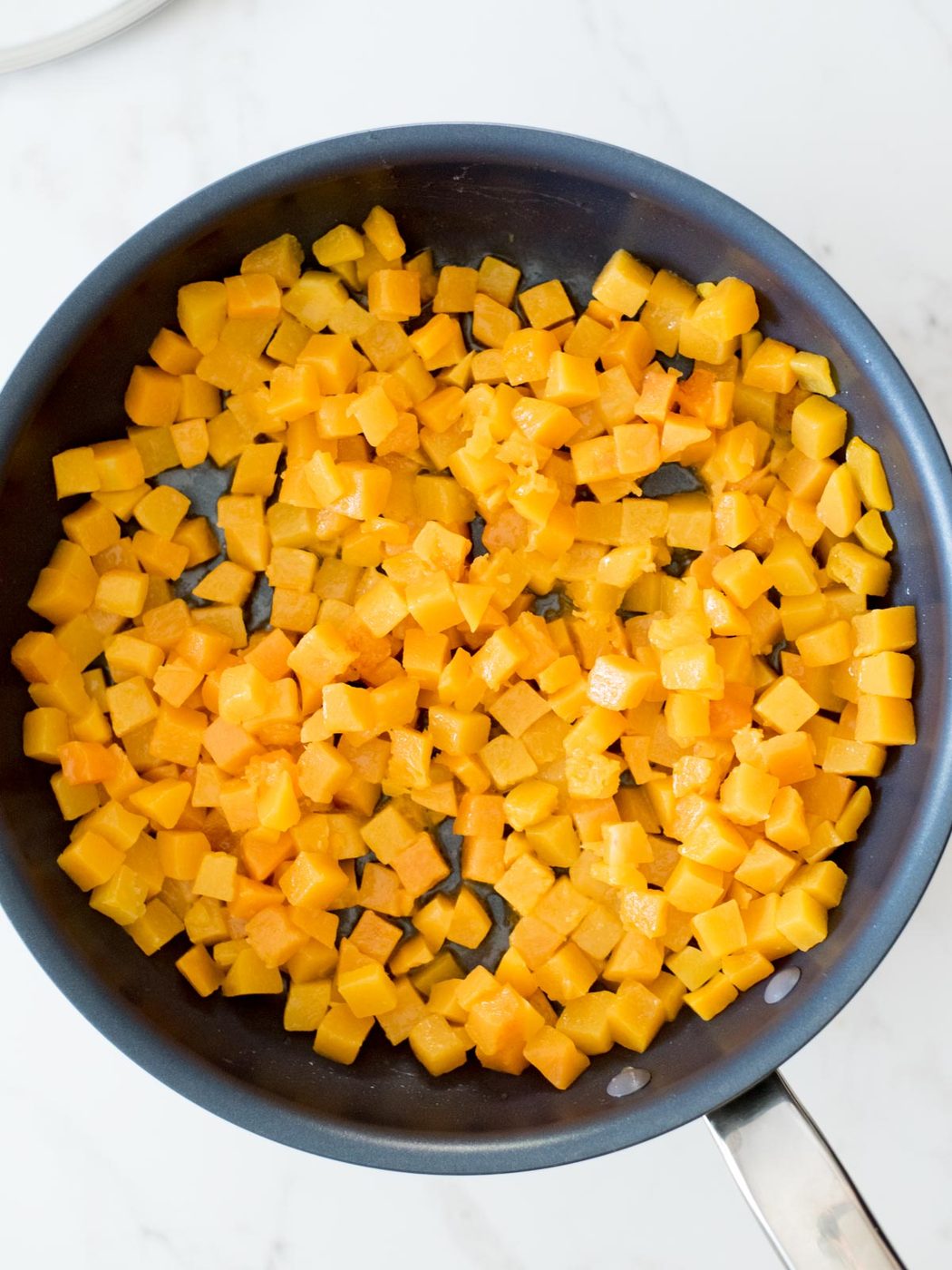 sautéed butternut squash in a skillet after being cooked down