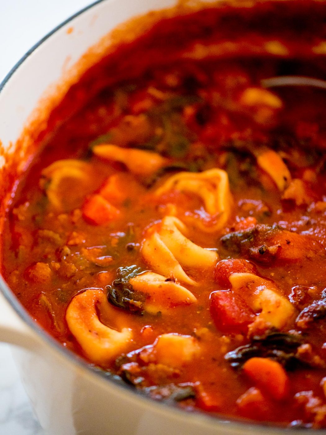 spinach tortellini soup in a dutch oven