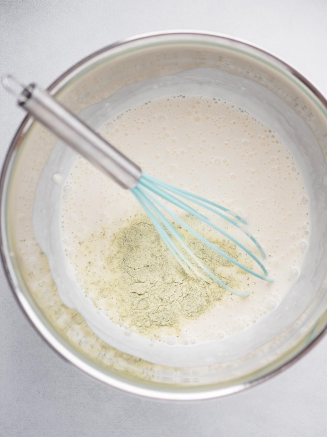 Dry ranch seasoning added to the mixing bowl.