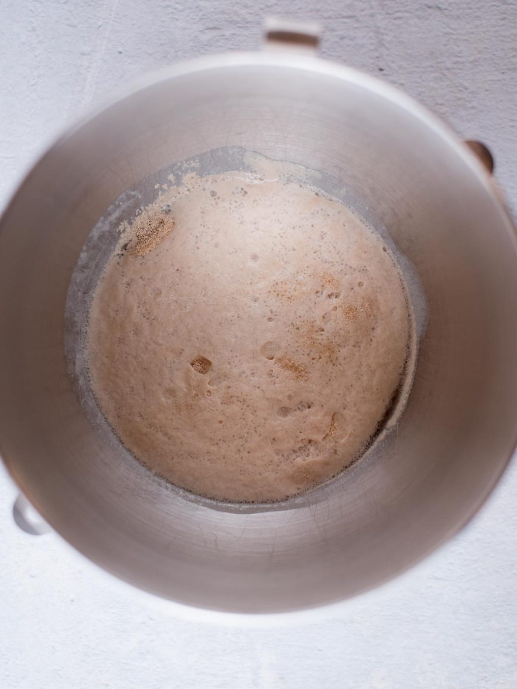 yeast, sugar, and water bloomed in a mixing bowl