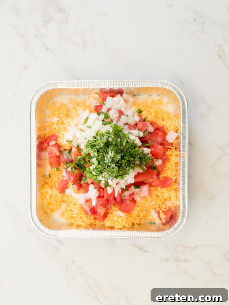 Ultimate Smoked Queso Dip 4 all ingredients for smoked queso dip in an aluminum pan