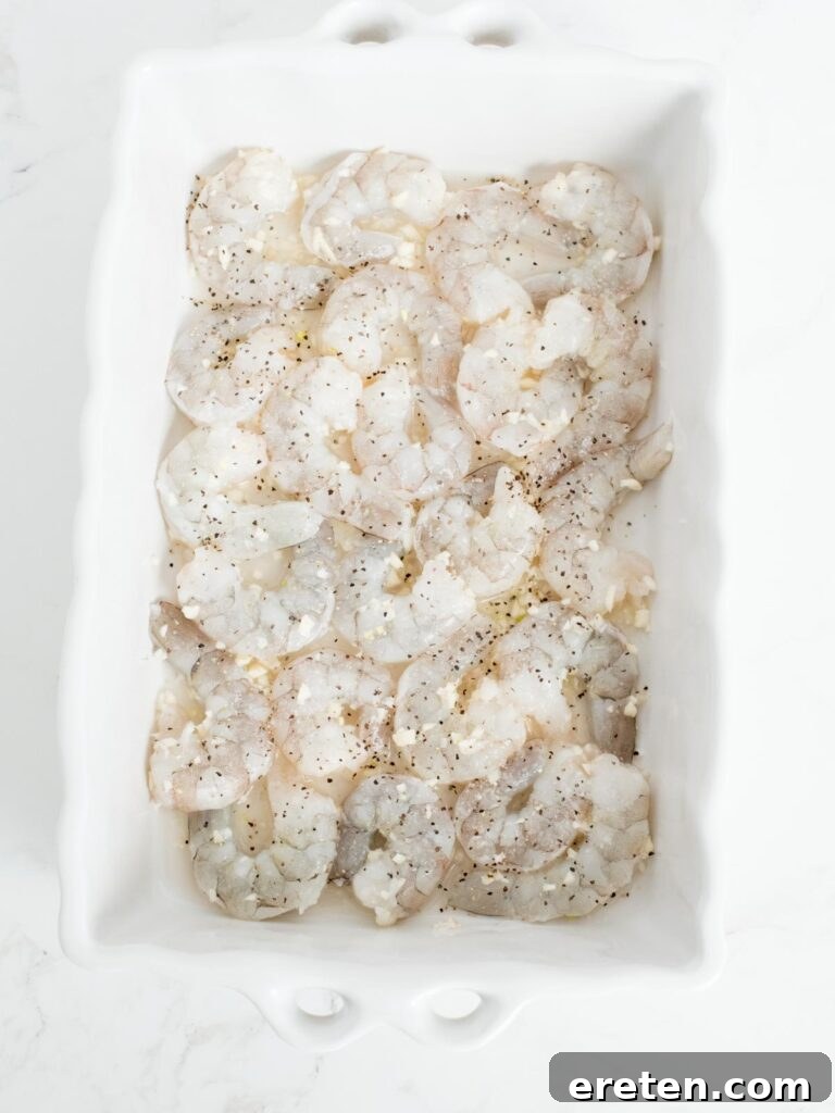 No-Fuss Baked Shrimp Scampi 6 shrimp, garlic, and wine mix in a baking dish topped with salt and pepper