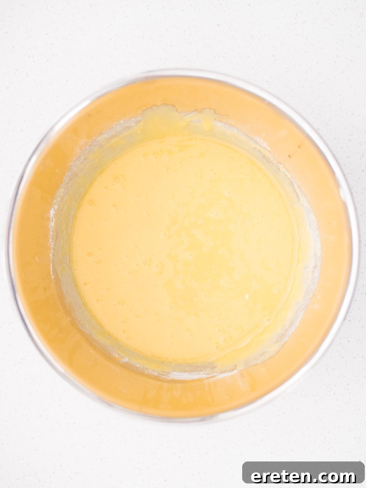 The smooth black cherry ice cream custard base in a mixing bowl, ready for churning.