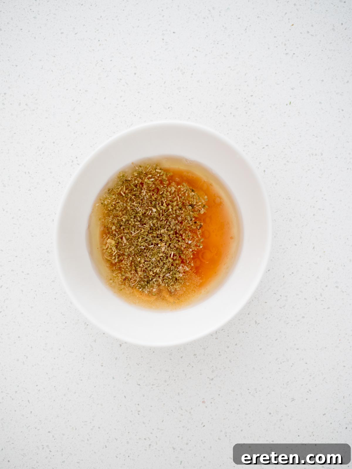 greek dressing ingredients in a bowl