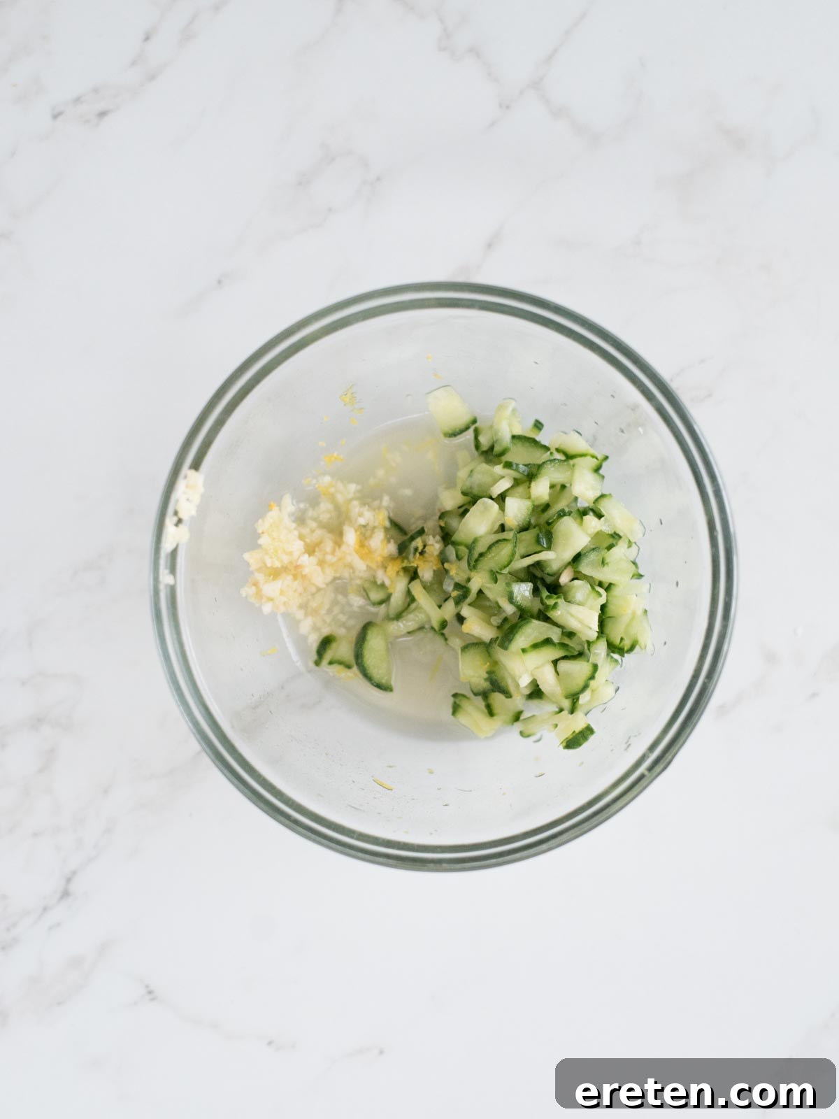 english cucumber, lemon zest, lemon juice, and garlic in a mixing bowl