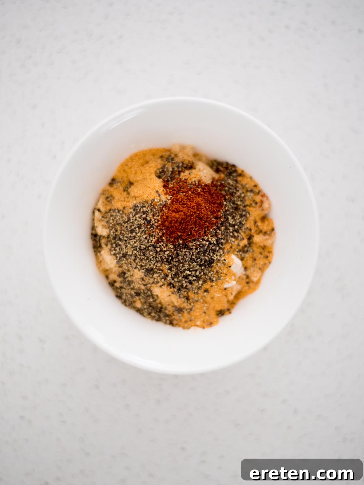 Pint-Infused Smoked Chicken Feast 4 poultry dry rub ingredients in a small mixing bowl