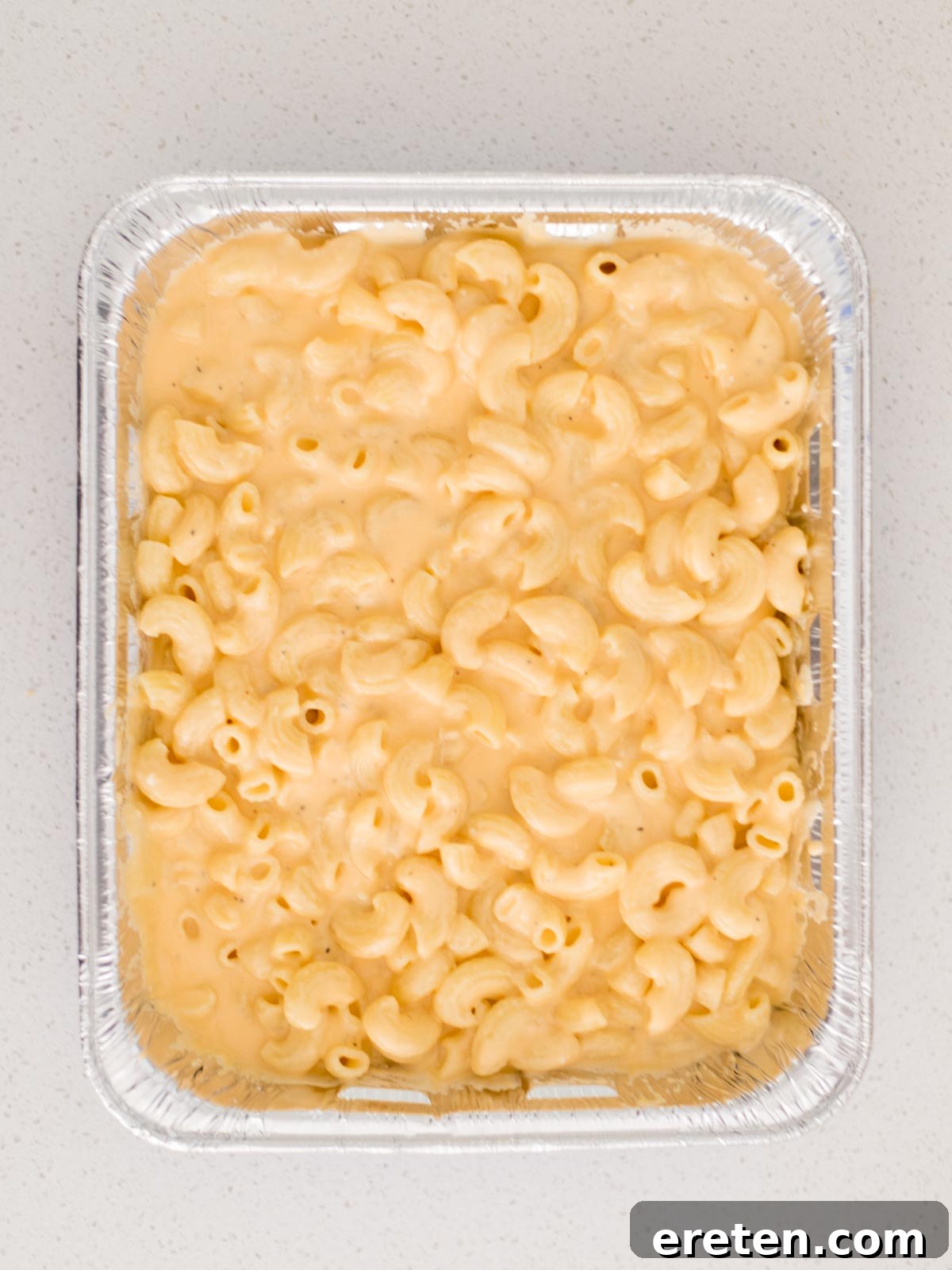 Next-Level Smoked Macaroni 12 cheese sauce and cooked elbow pasta combined in disposable cake pan