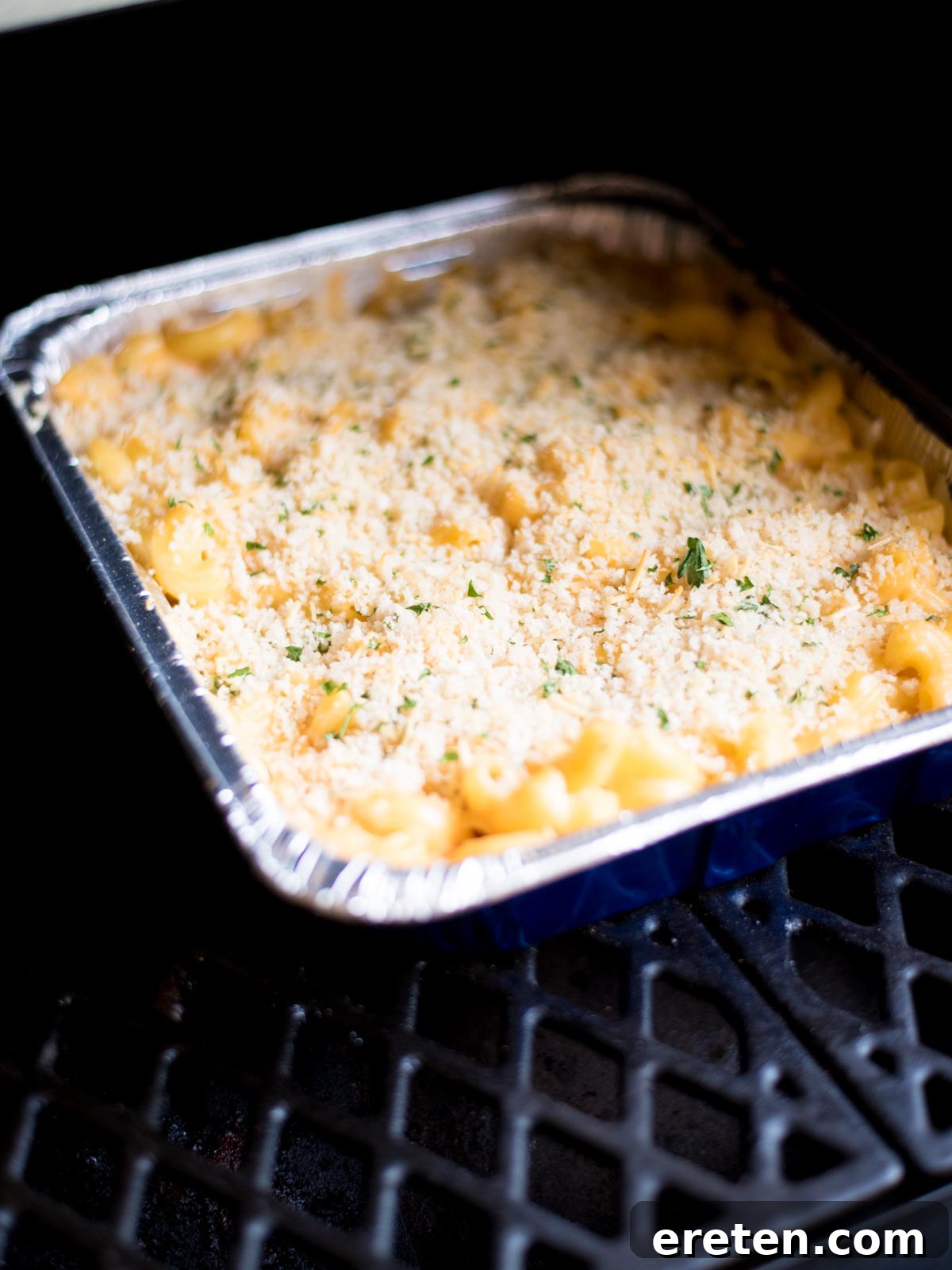 Next-Level Smoked Macaroni 18 macaroni and cheese in a disposable cake pan inside the pit boss pellet grill