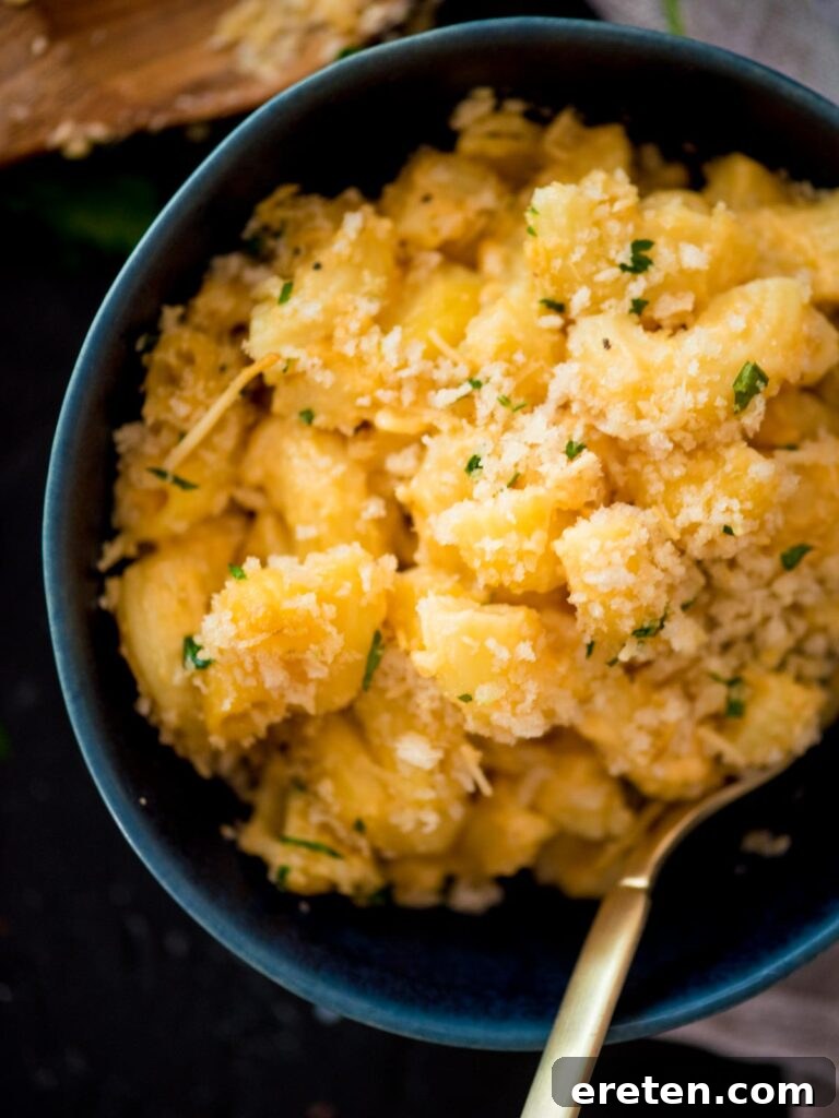 Next-Level Smoked Macaroni 19 smoked macaroni and cheese with a fork in a blue bowl