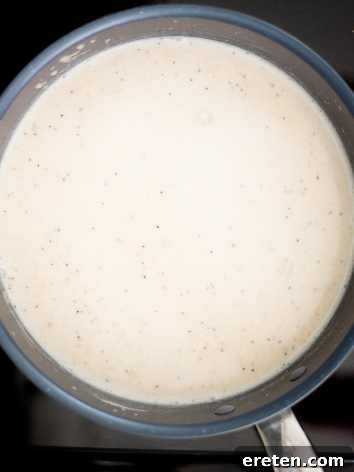Next-Level Smoked Macaroni 8 half and half added to the skillet with the roux