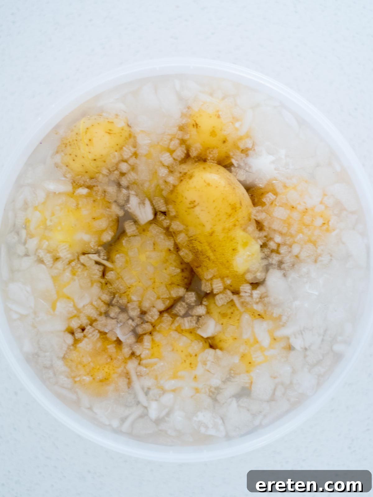 cooked potatoes and eggs in an ice bath