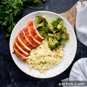 Flavorful Smoked Chicken Breast from Your Pellet Grill 8 Sliced smoked chicken breasts plated with broccoli and rice.
