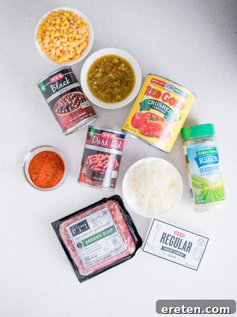 A flat lay photograph showcasing all the fresh and canned ingredients needed to prepare a delicious creamy taco soup.