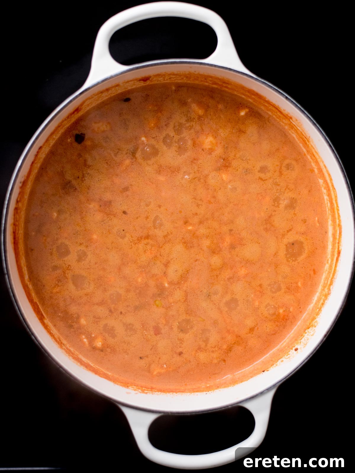 Finished creamy taco soup simmering gently in a dutch oven, rich and inviting.