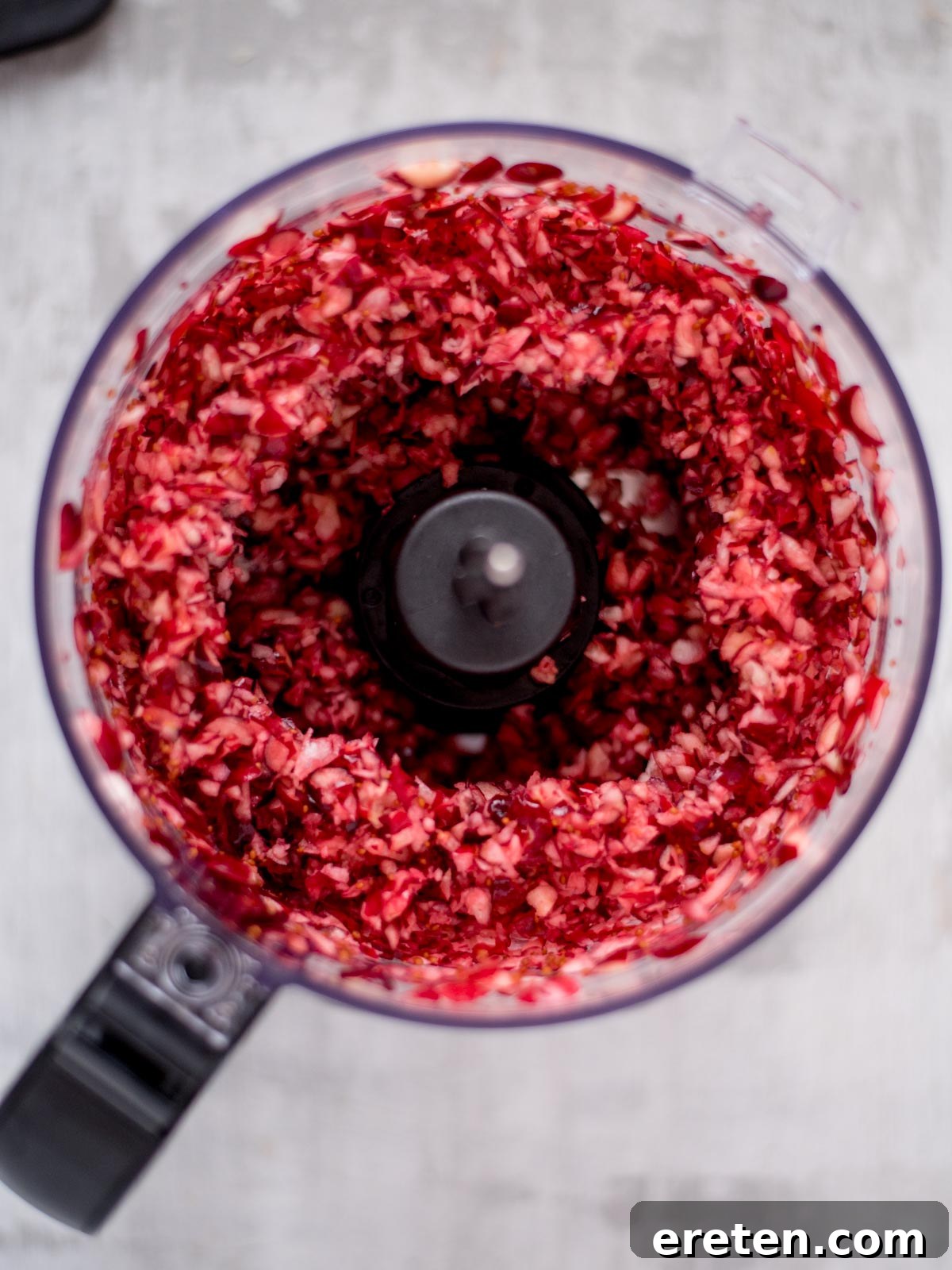 Sweet Heat Cranberry Jalapeño Dip 4 Food processor filled with coarsely chopped fresh cranberries.