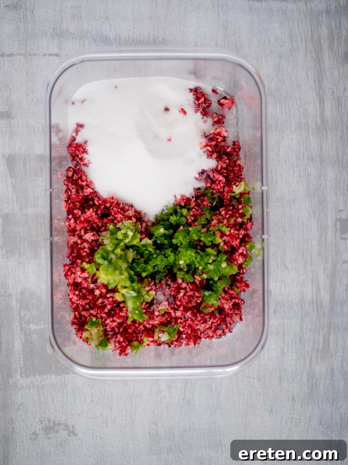 Sweet Heat Cranberry Jalapeño Dip 5 Close-up of finely diced cranberries and jalapeños in a bowl, showing texture.