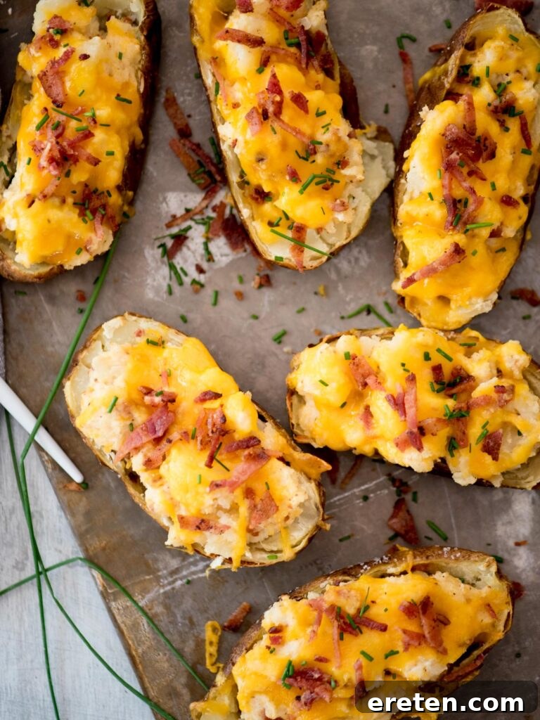 Twice baked potatoes topped with diced bacon.