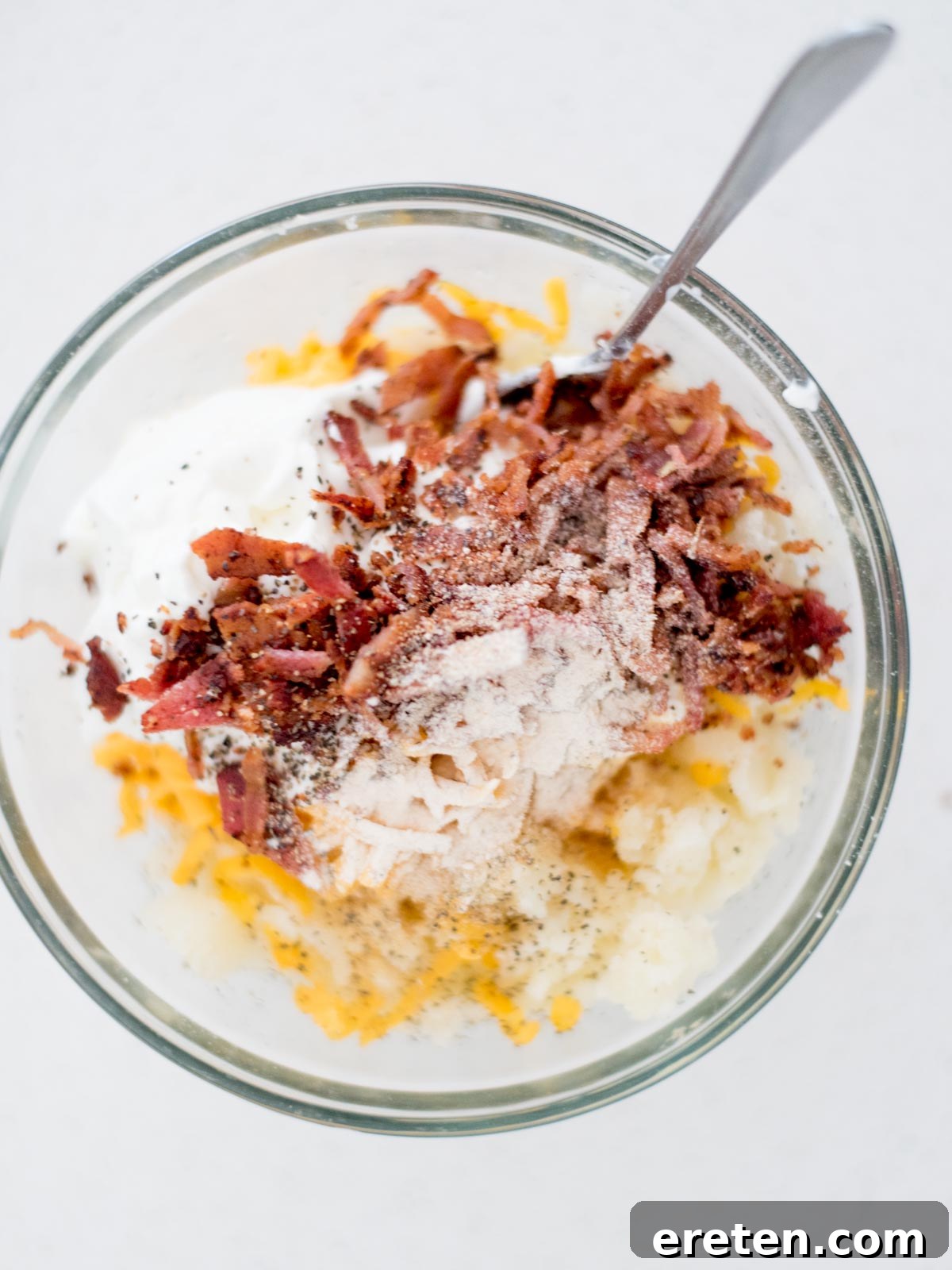 Seasoning added to the ingredients added to a mixing bowl to make the twice baked potatoes filling.
