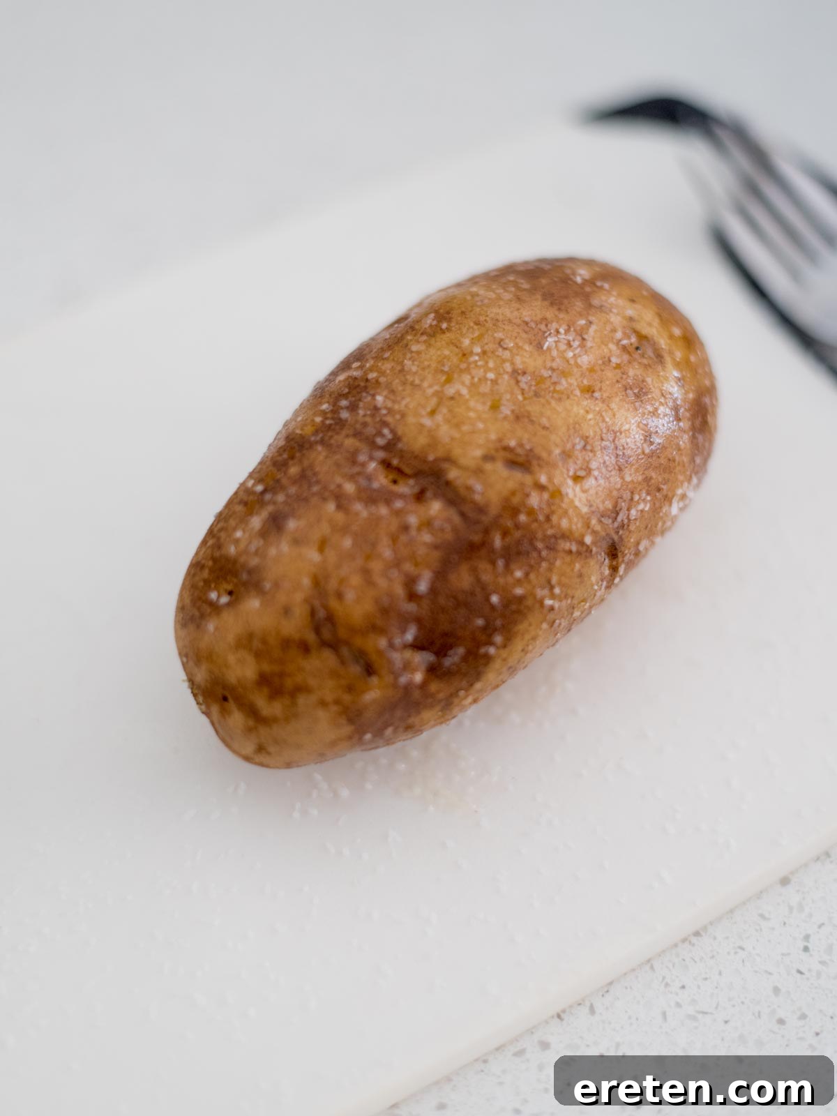 A whole potato rubbed with oil and salt.